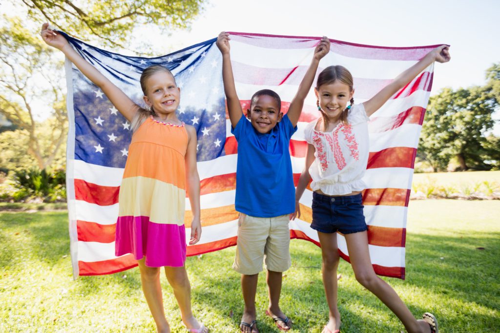 Happy children showing usa flag